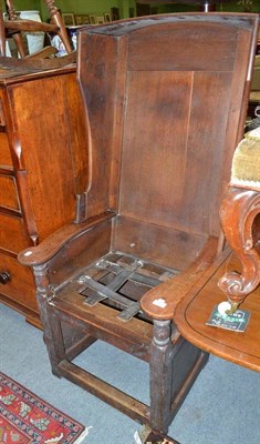 Lot 905 - A mid 19th century joined oak lambing chair, height 140cm