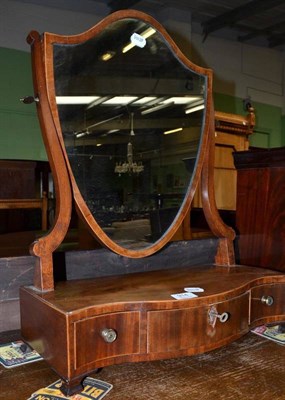 Lot 914 - A serpentine toilet mirror, width 47cm