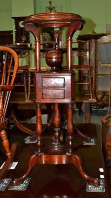 Lot 919 - Mahogany circular plant stand fitted with two drawers, height 86cm