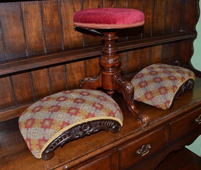 Lot 948 - A Victorian walnut revolving piano stool, height 46cm and a pair of Victorian footstools