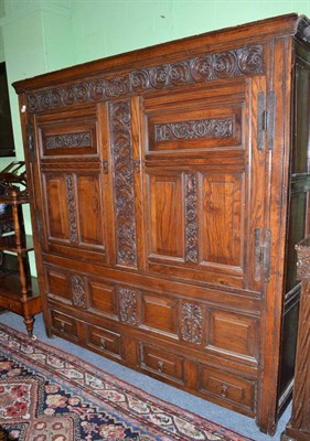 Lot 954 - Oak livery cupboard dated 1708, width 188cm