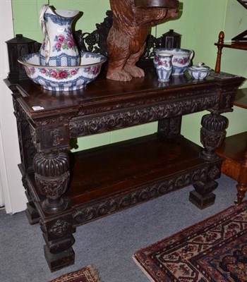 Lot 958 - A 19th century carved oak buffet serving table, width 124cm