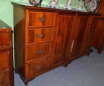 Lot 975 - Late 19th century mahogany and satinwood banded dwarf linen press, with three sliding trays,...