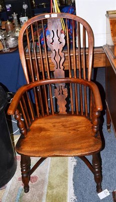 Lot 981 - A 19th century Windsor open armchair, width 53cm