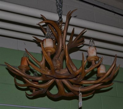 Lot 985 - A pair of faux antler chandeliers with six candle supports