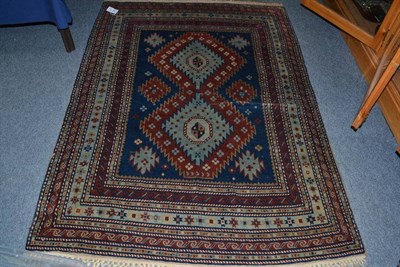 Lot 994 - Derbend rug, East Caucasus, the indigo field with two linked serrated medallions enclosed by...