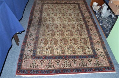 Lot 995 - Ghom rug, Central Persia, the ivory field with rows of boteh enclosed by floral borders, 216cm...