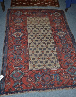 Lot 996 - North West Persian rug, the camel lattice field enclosed by madder borders of samovar motifs, 177cm