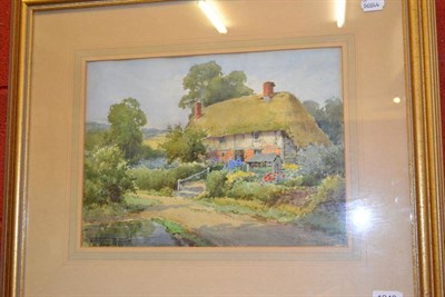 Lot 1249 - Sylvester Stannard RBA (1870-1951), Thatched cottage and garden, signed, watercolour 28cm by 38cm