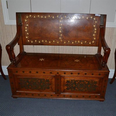 Lot 1322 - Ceylonese inlaid teak box settle with elephant-head arm rests, width 122cm