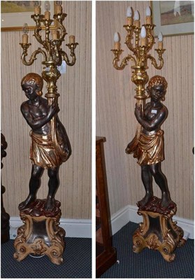 Lot 1325 - A pair of modern Blackamoor figural lamps, height 180cm