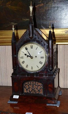 Lot 1327 - A Gothic style mahogany striking table clock