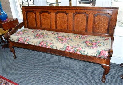 Lot 1333 - An 18th century oak and mahogany cross banded settle, length 192cm