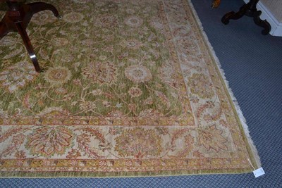 Lot 1341 - Ziegler design carpet, India, the moss green lattice field with columns of palmettes and...