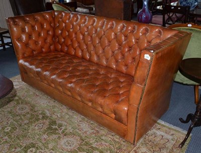 Lot 1343 - An early 20th century button and close nailed leather sofa, width 192cm