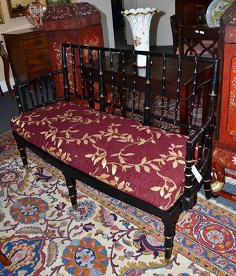 Lot 1352 - Ebonised and gilt bamboo settee, width 141cm