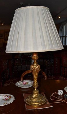 Lot 1353 - Gilt metal table lamp, height 46cm with silk gathered shade