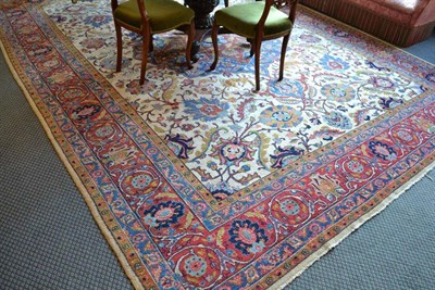 Lot 1355 - Tabriz carpet Persian Azerbaijan, the cream field centred by an indigo medallion surrounded by...