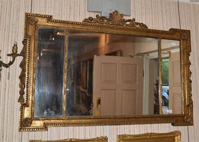 Lot 1357 - A reproduction gilt overmantel mirror in George II style, width 119cm