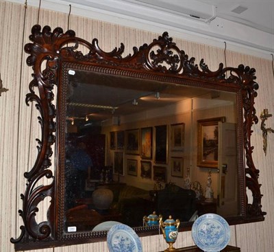 Lot 1360 - A Victorian carved rosewood overmantel mirror with shell and scroll sides and top, width 160cm