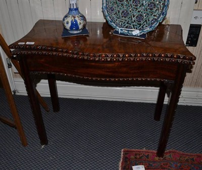 Lot 1361 - A George III Chippendale style mahogany fold-over card table, width 86cm