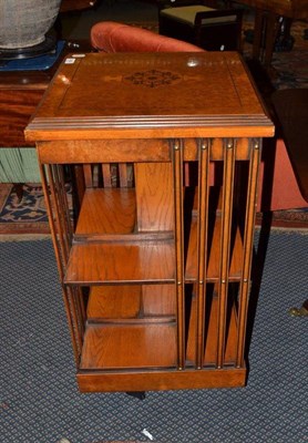 Lot 1389 - Reproduction burr oak revolving bookcase, height 86cm