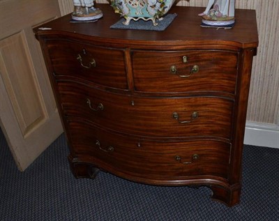 Lot 1394 - A mahogany, satinwood, boxwood and ebony strung serpentine front chest of drawers, in the manner of