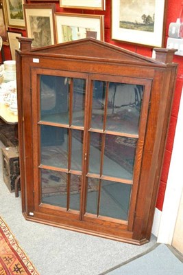 Lot 1403 - Glazed door oak corner cupboard, height 136cm