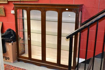 Lot 1408 - A 20th century mahogany display cabinet with four glazed doors, width 152cm