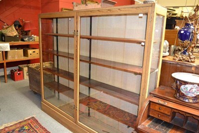 Lot 1411 - An Edwardian display cabinet with glazed doors and four adjustable shelves, width 205cm