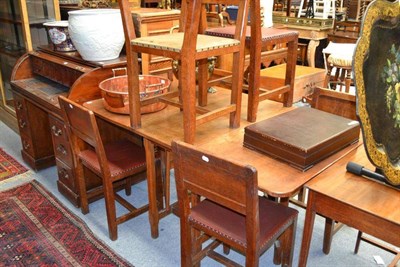 Lot 1413 - A set of six (5+1) Kingpost oak panel back chairs, nailed hide seats, on four square section...