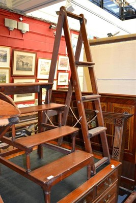 Lot 1428 - A set of mahogany library steps and a set of folding mahogany library ladders