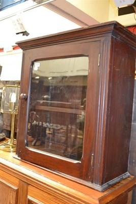 Lot 1439 - A Victorian mahogany wall cupboard and a resin figure of an Indian lady, height 80cm