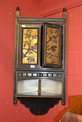 Lot 1460 - An Aesthetic ebonised and part gilt corner cupboard, height 104cm