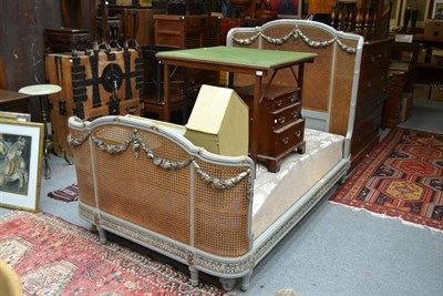 Lot 1469 - A French style 4ft bed with cane head board and foot board