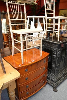 Lot 1484 - Small reproduction yew chest of drawers, width 74cm and a pair of painted caned chairs