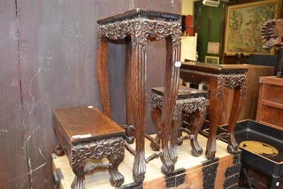 Lot 1500 - Four Chinese carved hardwood small occasional tables, early 20th century, carved on three sides...