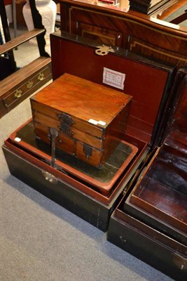 Lot 1517 - A Japanese elm small table chest of two slim drawers over two deep drawers, with iron handles...