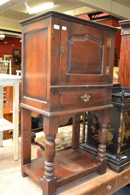 Lot 1520 - Reproduction oak cupboard with brushing slide and draw, width 62cm, by Chapman's of Siesta House