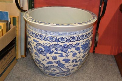 Lot 1571 - A 20th century Chinese fish bowl decorated with dragons and flaming pearls, 54.4cm diameter