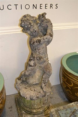 Lot 1584 - Stone fountain as Cupid - repaired, height 105cm