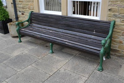 Lot 1638 - A large cast iron garden bench, probably Victorian, with lion mask handles, length 260cm