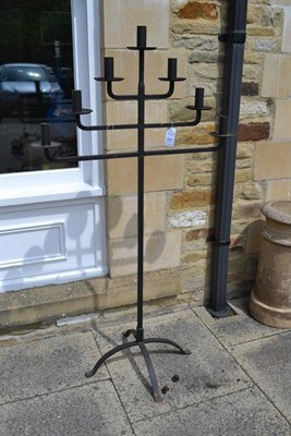 Lot 1646 - A wrought iron candle stand, with seven candle holders, painted black, height 148cm