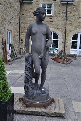 Lot 1653 - A 19th century carved stone sculpture of a classical nude maiden, on circular base with carved tree