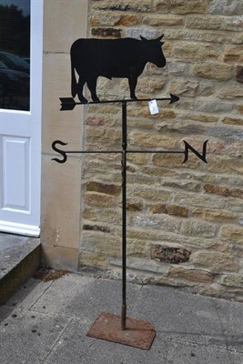 Lot 1658 - A wrought iron weather vane, with a horned bull on the top, 162cm high