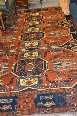 Lot 1677 - Caucasian design carpet, North Afghanistan, the deep indigo field with three large medallions...