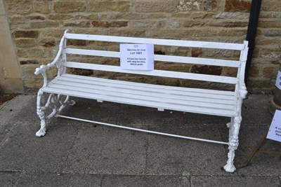 Lot 1691 - A cast iron bench with dog handles, 160cm width