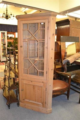 Lot 1694 - A pine free standing corner cupboard, height 199cm