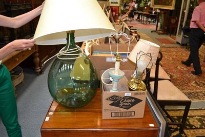 Lot 1695 - A large green glass Carboy bottle, converted into a lamp, 70cm high; and four other small table...