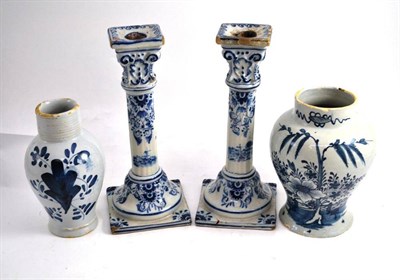 Lot 12 - A Delft baluster vase, probably Dutch, circa 1760, painted in blue with chinoiserie foliage...